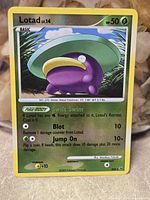 Front of Shiny Lotad card showing artwork, set info, and condition