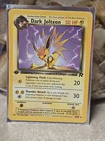 Front of Dark Jolteon card in sleeve