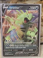 Front of Tyranitar V promo card showing artwork, stats and card number