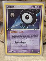 Front of Unown J cosmos holo card showing artwork, attacks, 60 HP