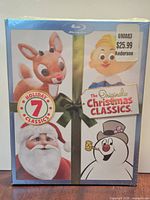 Front of sealed Christmas Classics case with character artwork and 7 Holiday Classics badge