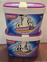 Front view of both stacked sealed OxiClean Odour Blasters containers