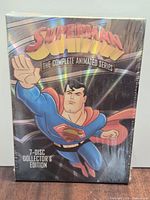 Front view of sealed Superman Complete Animated Series DVD box showing title and artwork