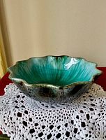 Top view showing scalloped rim and interior drip glaze