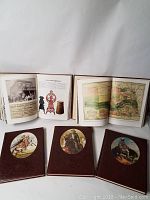 Five hardcover books from Time Life's The Old West series in excellent condition, shown open to pages with images and maps and closed with western art medallions on covers.