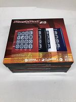 Three stacked boxes of Flashpad 2.0 electronic games with visible packaging showing front and sides. The boxes are unopened and in new condition.
