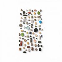 Full array of assorted gemstone cabochon beads laid out