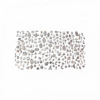 Overall view of entire assortment of metal charms laid out