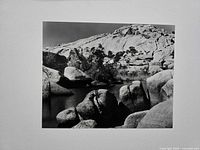 Full view of photograph within mat showing Barker Dam scene