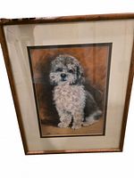 Front view of framed signed dog portrait