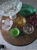 Top view of assorted crystal and colored glass pieces on table