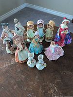 Group view of all figurines and bud vases on table