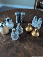 All six pairs of salt and pepper shakers displayed on table