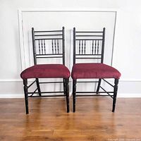 Front view of both children's spindle-back chairs showcasing design and upholstery