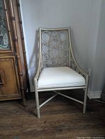 Front view of champagne bamboo chair showing circular back design and seat cushion