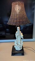 Complete lamp: porcelain Shou Lao figure, wooden base, wicker shade
