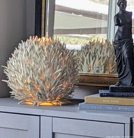 Lamp lit on tabletop showing overall form and glow
