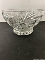 Side view of crystal bowl showing pinwheel and diamond cut design and star-cut foot