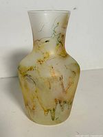 Full view of vase front showing frosted finish and abstract streaks