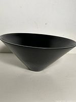 Side view of conical matte black bowl