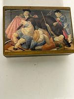Top view showing Botero artwork on lid