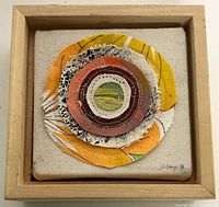 Front view of framed textile artwork