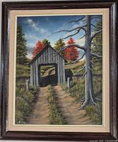 Full view of framed painting showing covered bridge landscape, signature visible