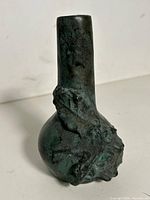 Full view of vase front showing shape and patina