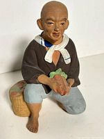 Frontal view of figurine showing full pose, colors and accessories