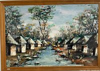 Full view of framed painting showing rural village scene, dimension and frame visible