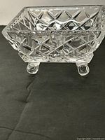 Front view of square footed crystal dish showing diamond pattern and feet