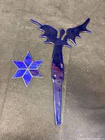 Angel stake and star suncatcher laid flat showing size and color