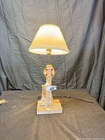 Full view of lamp with shade illuminated