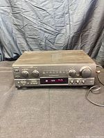 Front view of Technics SA-AX730 receiver showing controls and display