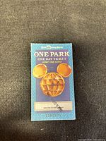 Front of ticket with logo and pricing