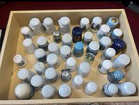 Top view of box showing full assortment of thimbles
