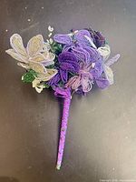 Full view of bouquet showing beaded flowers and wrapped stem