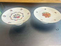 Both porcelain pedestal cake stands top view