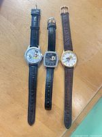 Front view of all three watches laid out side by side