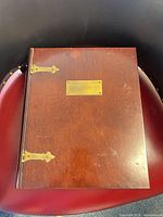 Closed box top showing brass nameplate and hinges