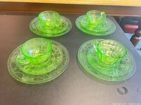 All four trios arranged showing cup, saucer and salad plate