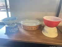 Full lot view showing all bowls and casserole