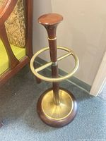 Full view of wood and brass umbrella stand
