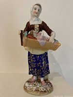 Front view of entire Meissen figurine showing colors, pose and base