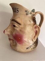 Left side view displaying handle and OLD IRISH WHISKY inscription