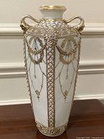 Full front view showing entire vase and gilded design