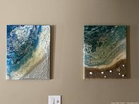 Both canvases displayed on wall