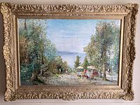 Full view of framed painting showing carved frame and artwork