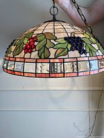 Full chandelier hung showing dome grapevine design and chain