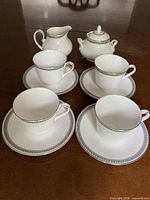 Entire set of cups, saucers, creamer, sugar bowl